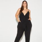 Plus Model Erica Lauren modeling a plus size black jumpsuit by @shoploveyourz