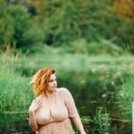 Curvy Model Ruby Roxx wearing plus size peach dress