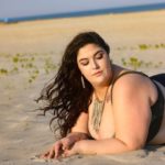 Plus size model Faith Costa (Faith PlusFashion) wearing a black two piece plus size bikini