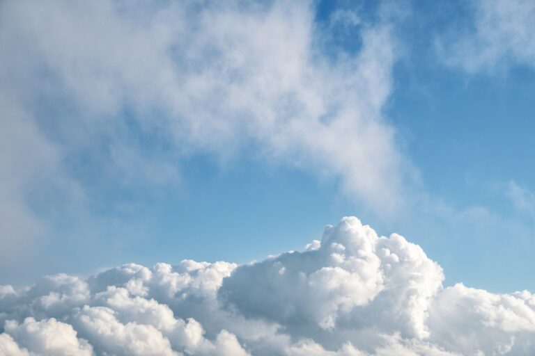 A picture of a blue sky with fluffy white clouds. Source: Image by Enrique (elg21-3764790) from Pixabay.